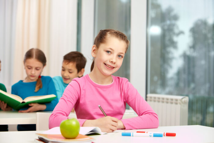 concentrated girl writing note scaled